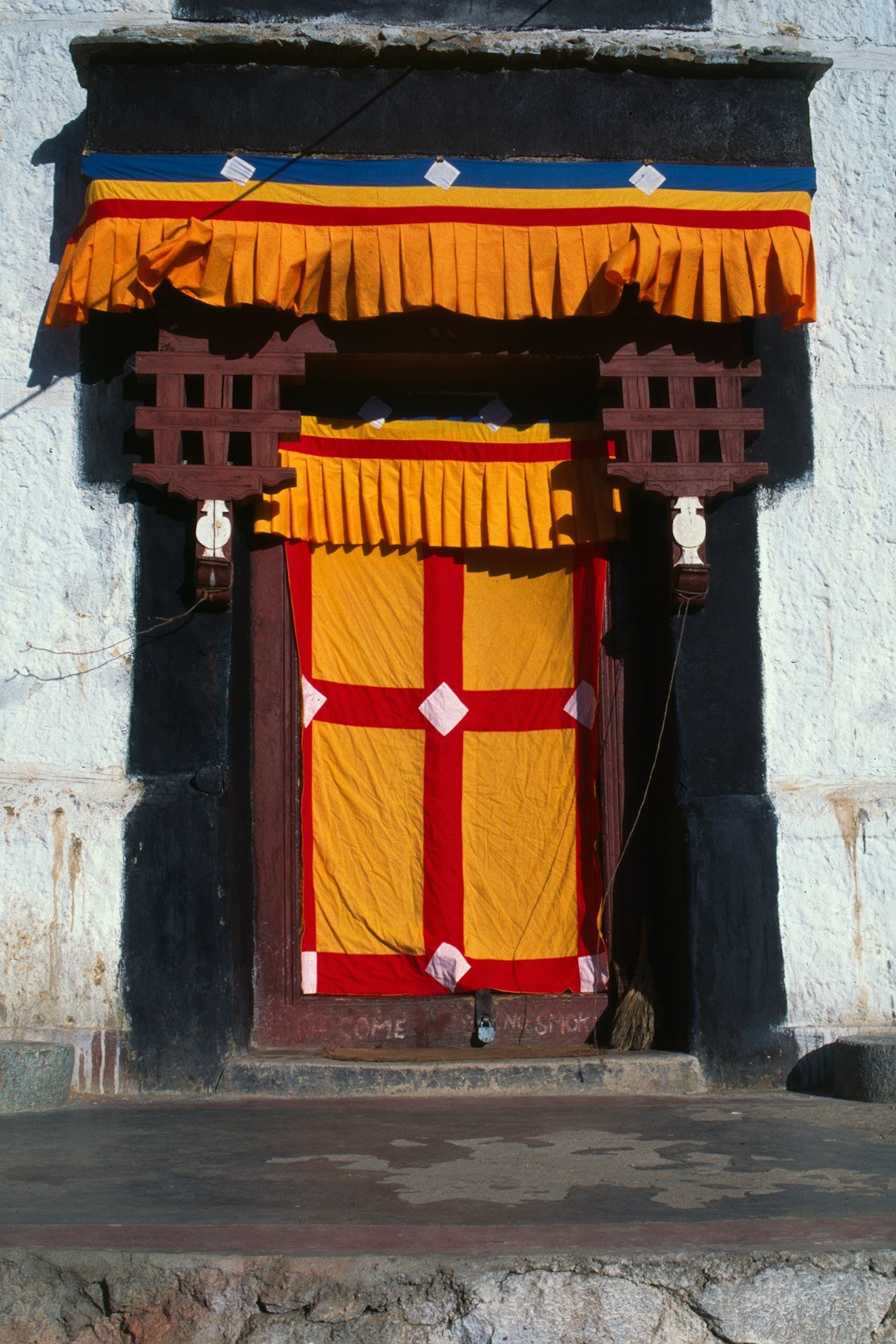ornate-doorway-with-yellow-and-red-fabric-decorations-758ehxcig88